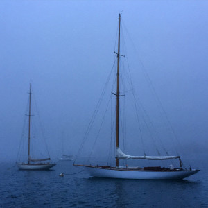 Boats at anchor on a misty evening in Newport