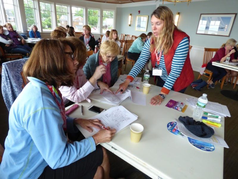 Captain Edana Long shows session participants how to read a weather map. Photo: WSC/Nicole Corriel